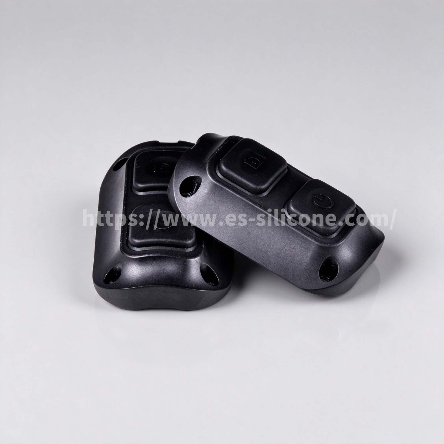 Waterproof silicone-over-plastic buttons for night-vision devices